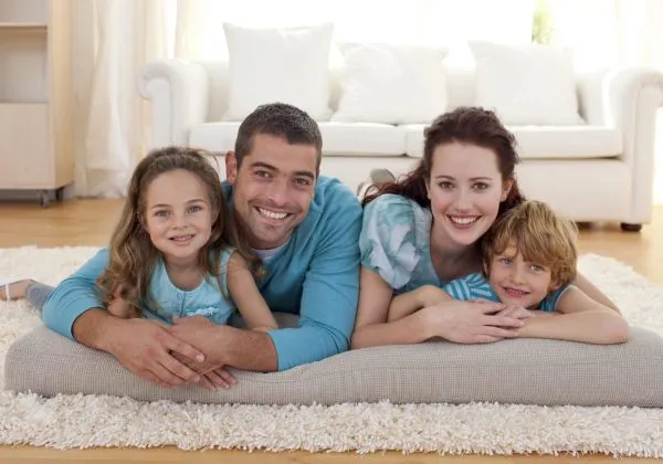 Family on floor lying in living-room